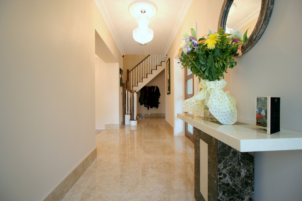 Contemporary entrance in Dublin with white walls and porcelain flooring.