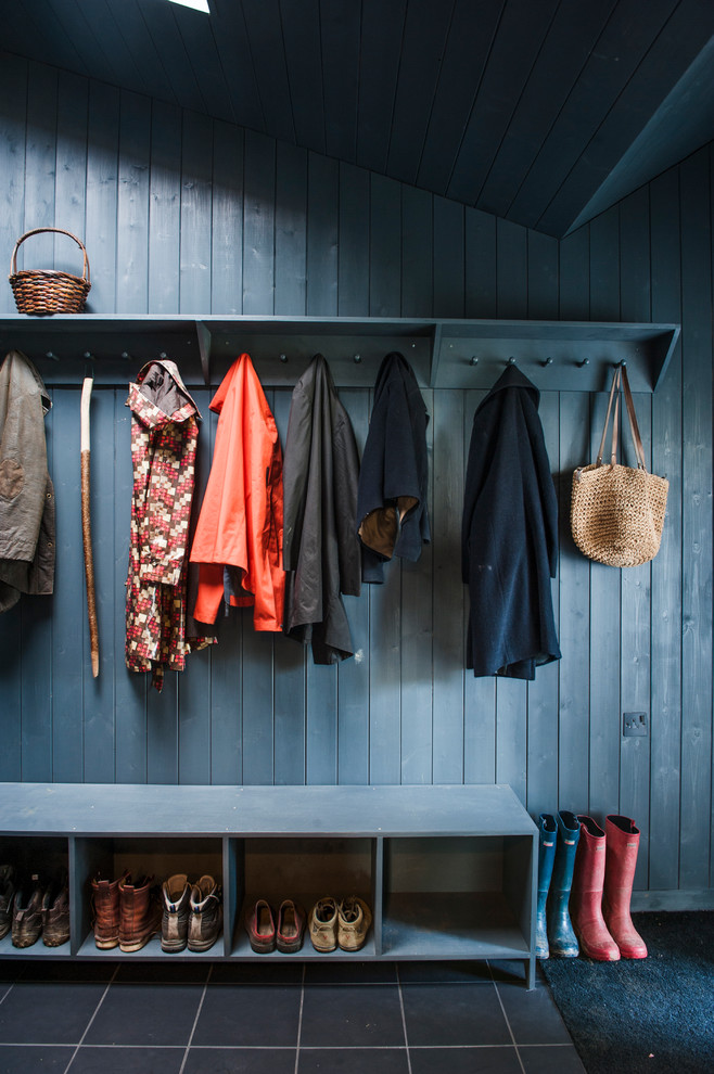 Rural boot room in London with blue walls.