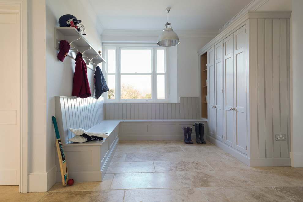 Inspiration for a medium sized traditional boot room in Essex with white walls and travertine flooring.