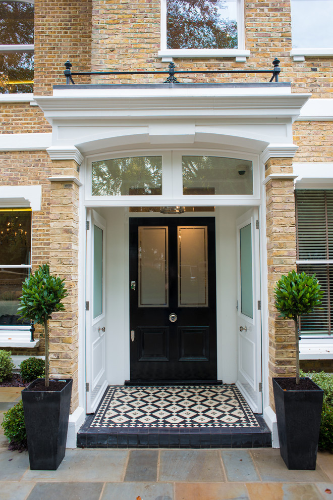 Ornate front door photo in Berkshire with a black front door