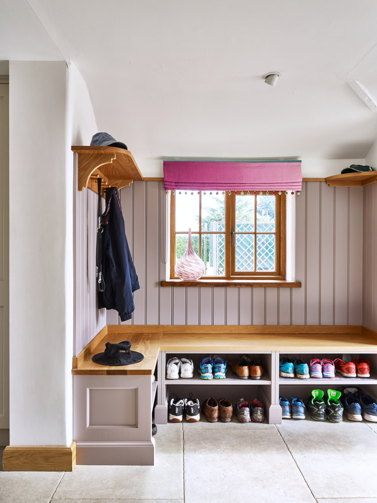 Example of a small country gray floor mudroom design in London with white walls