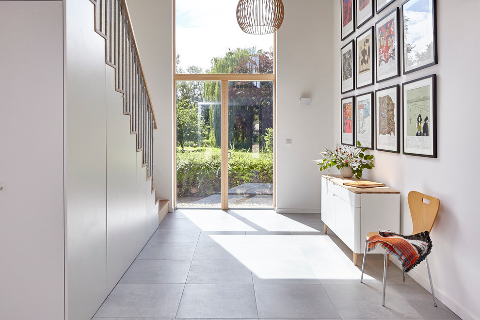 Design ideas for a large contemporary entrance in Berkshire with white walls and ceramic flooring.