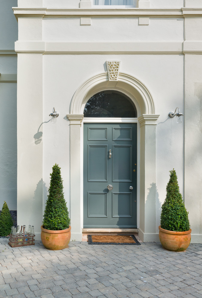 Inspiration for a transitional entryway remodel in Devon with a blue front door