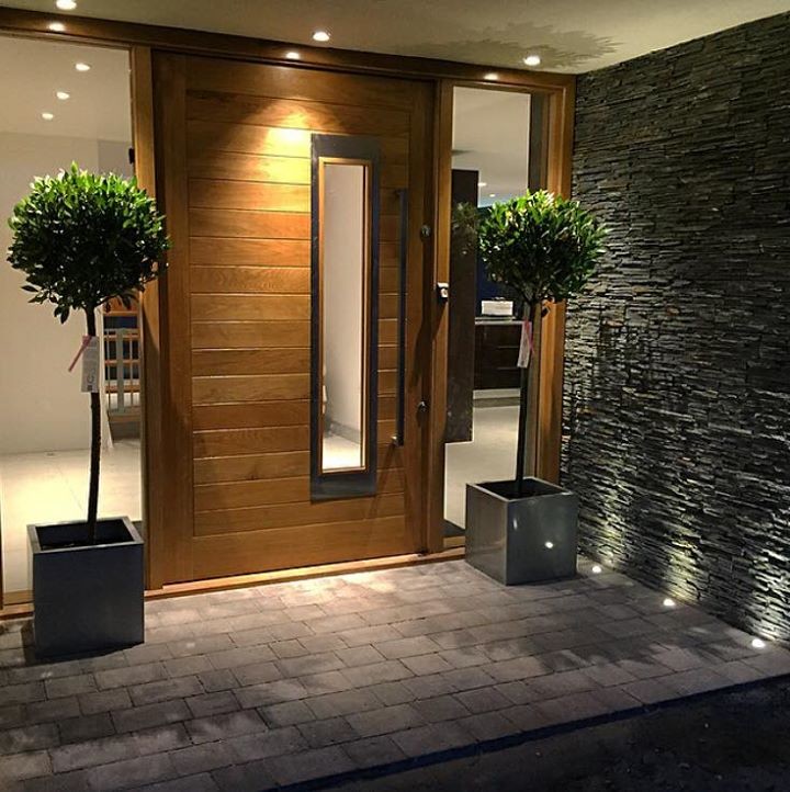 Trendy entryway photo in Other with gray walls and a medium wood front door