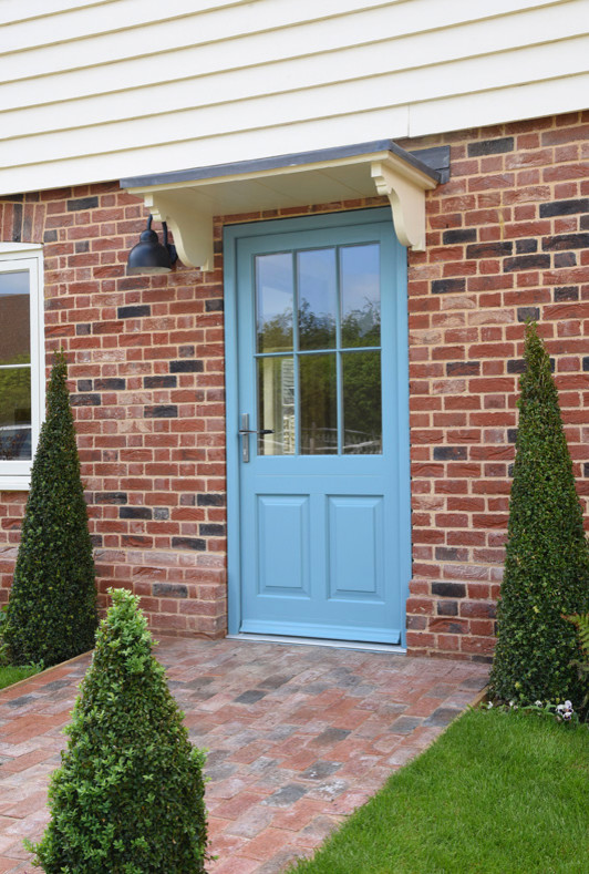 Inspiration for a medium sized farmhouse front door in Kent with a single front door and a blue front door.