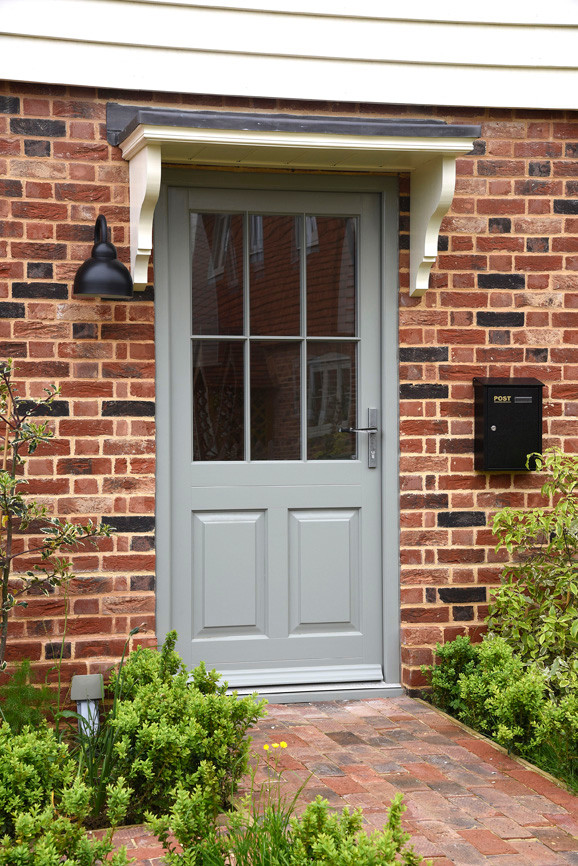 Photo of a medium sized farmhouse front door in Kent with a single front door and a grey front door.