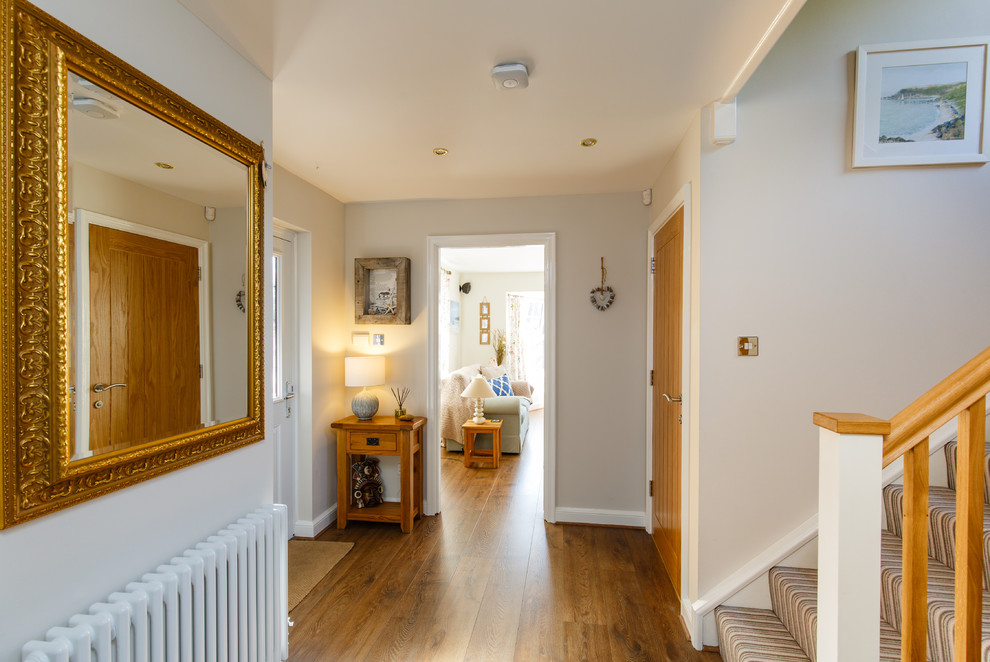 Inspiration for a classic entrance in Cambridgeshire with grey walls and laminate floors.
