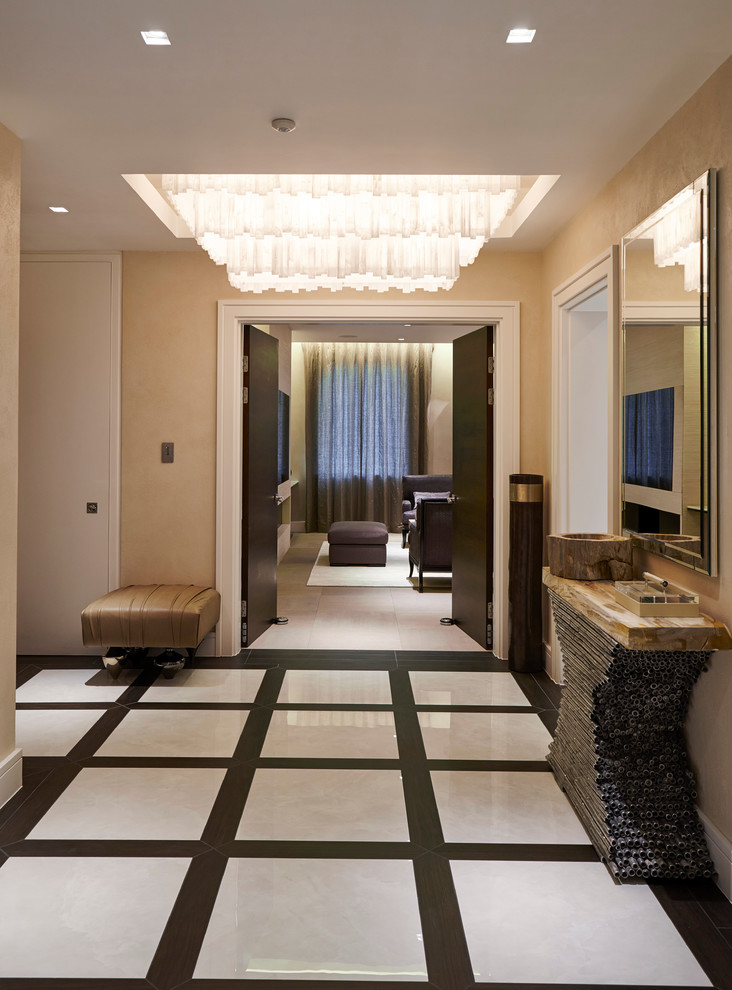 Design ideas for a large contemporary foyer in London with beige walls and ceramic flooring.