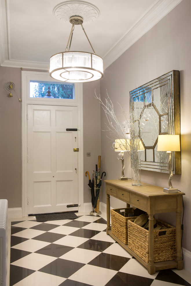 Inspiration for a classic hallway in Oxfordshire with grey walls, a single front door, a white front door and feature lighting.
