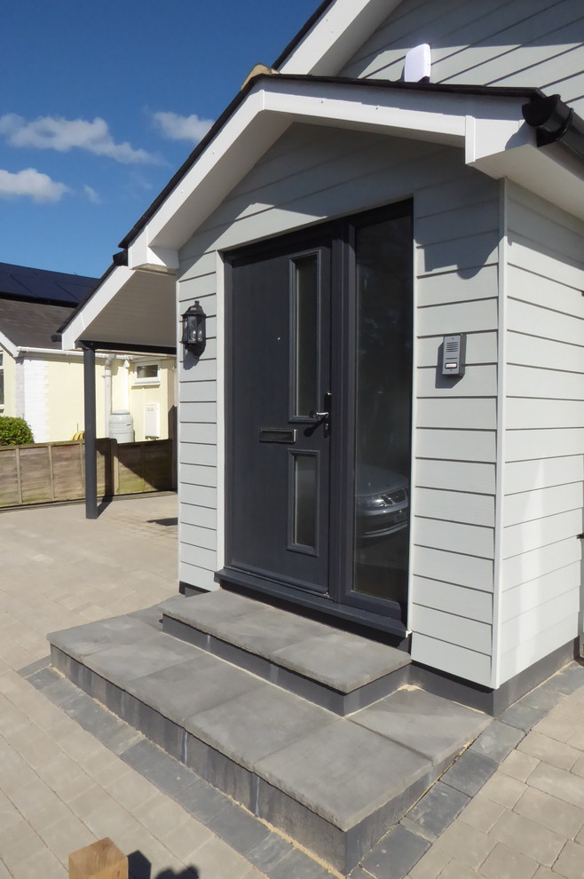 Inspiration for a contemporary entrance in Kent with a single front door and a grey front door.