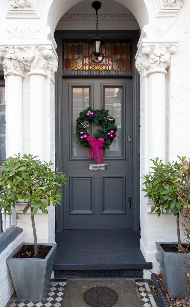 Inspiration for a traditional entrance in London with feature lighting.