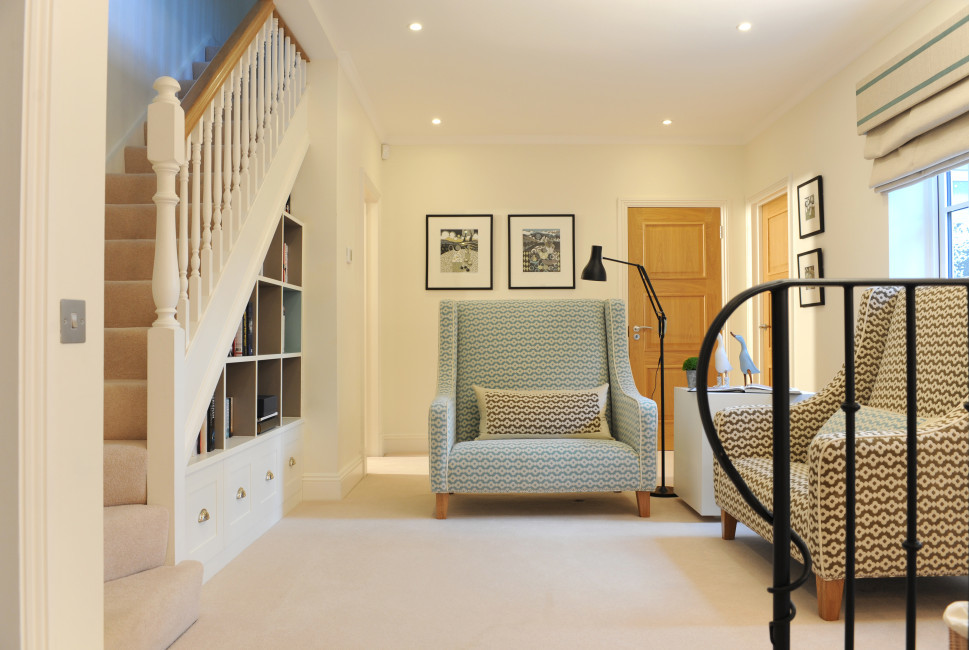 Inspiration for a mid-sized contemporary carpeted and beige floor foyer remodel in West Midlands with white walls