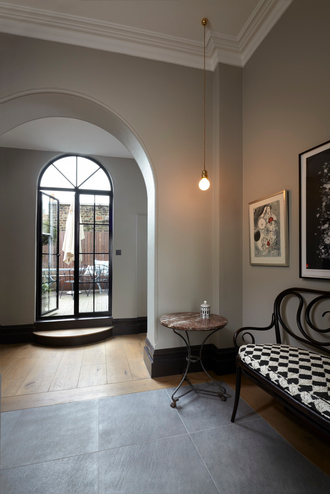 Photo of a traditional hallway in London with grey walls and a double front door.