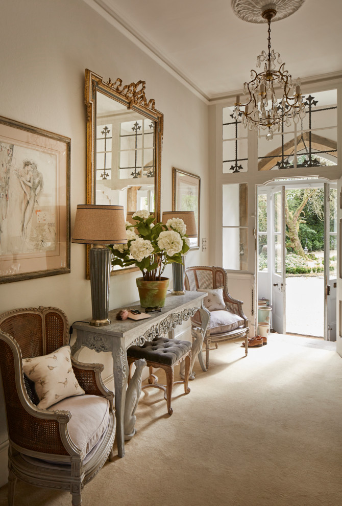 Large hallway in Other with grey walls, carpet, a double front door and beige floors.