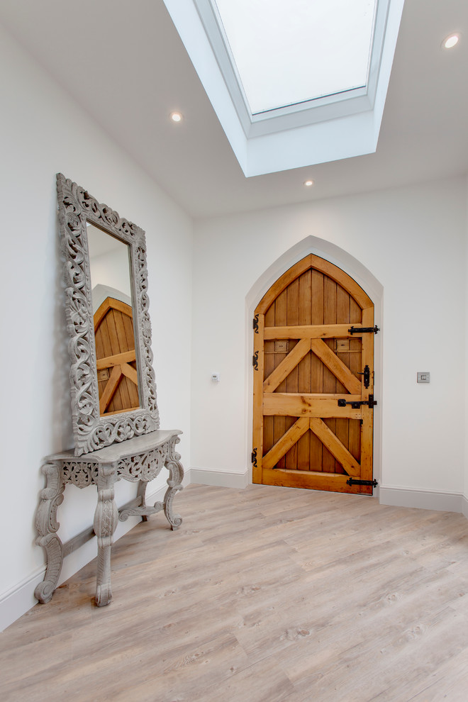Inspiration for a medium sized classic entrance in Other with white walls, light hardwood flooring, a single front door and a medium wood front door.