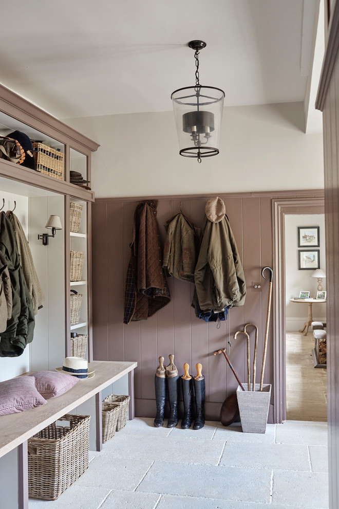 Design ideas for a medium sized traditional boot room with white walls, grey floors and feature lighting.