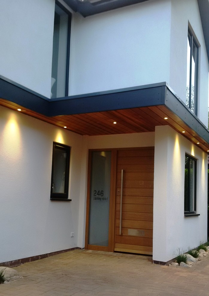 Photo of a contemporary front door in Cornwall with white walls and a single front door.