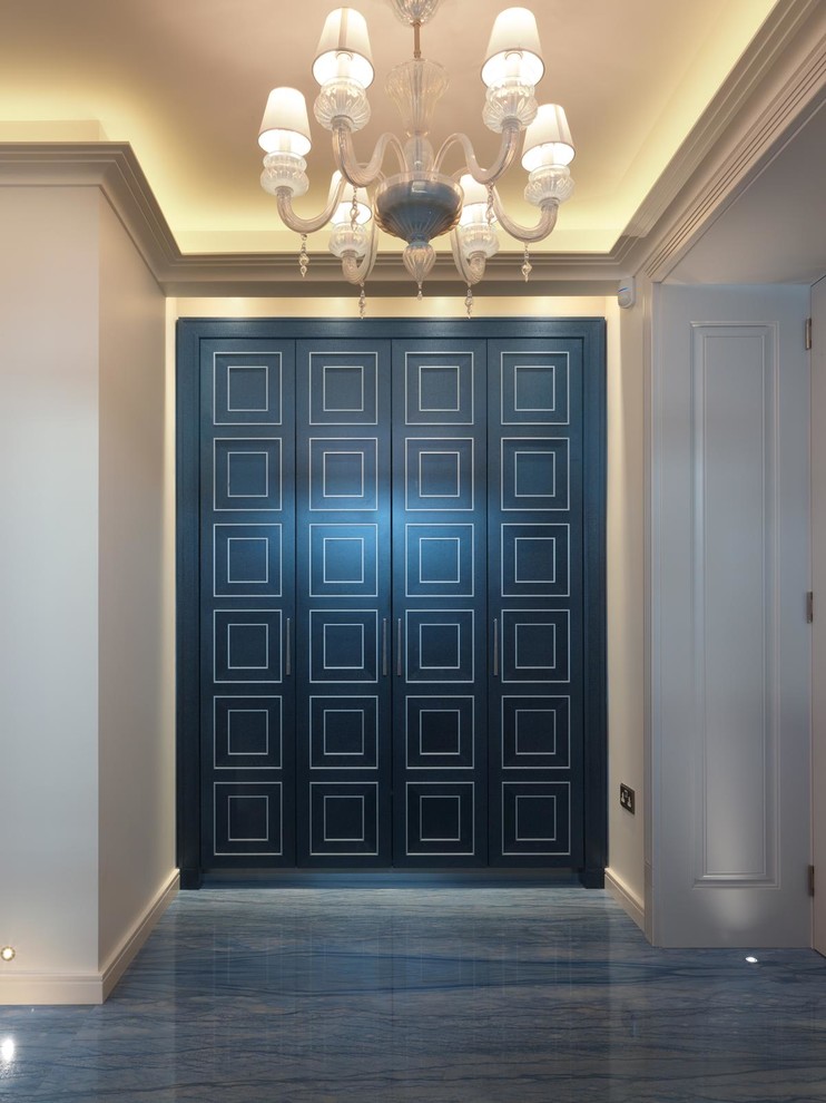 This is an example of a contemporary entrance in London with white walls, marble flooring, a double front door and a blue front door.