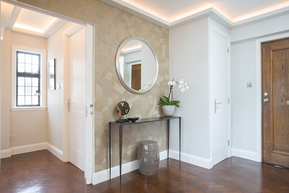 Design ideas for a medium sized classic foyer in London with beige walls, medium hardwood flooring and a single front door.
