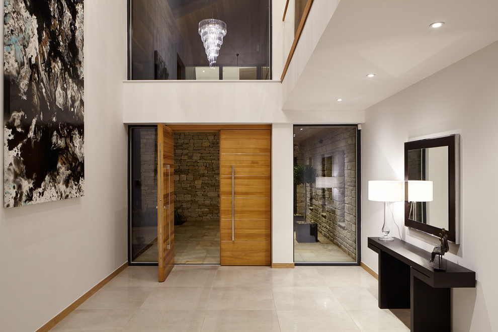 Design ideas for a contemporary front door in Buckinghamshire with a double front door and a medium wood front door.