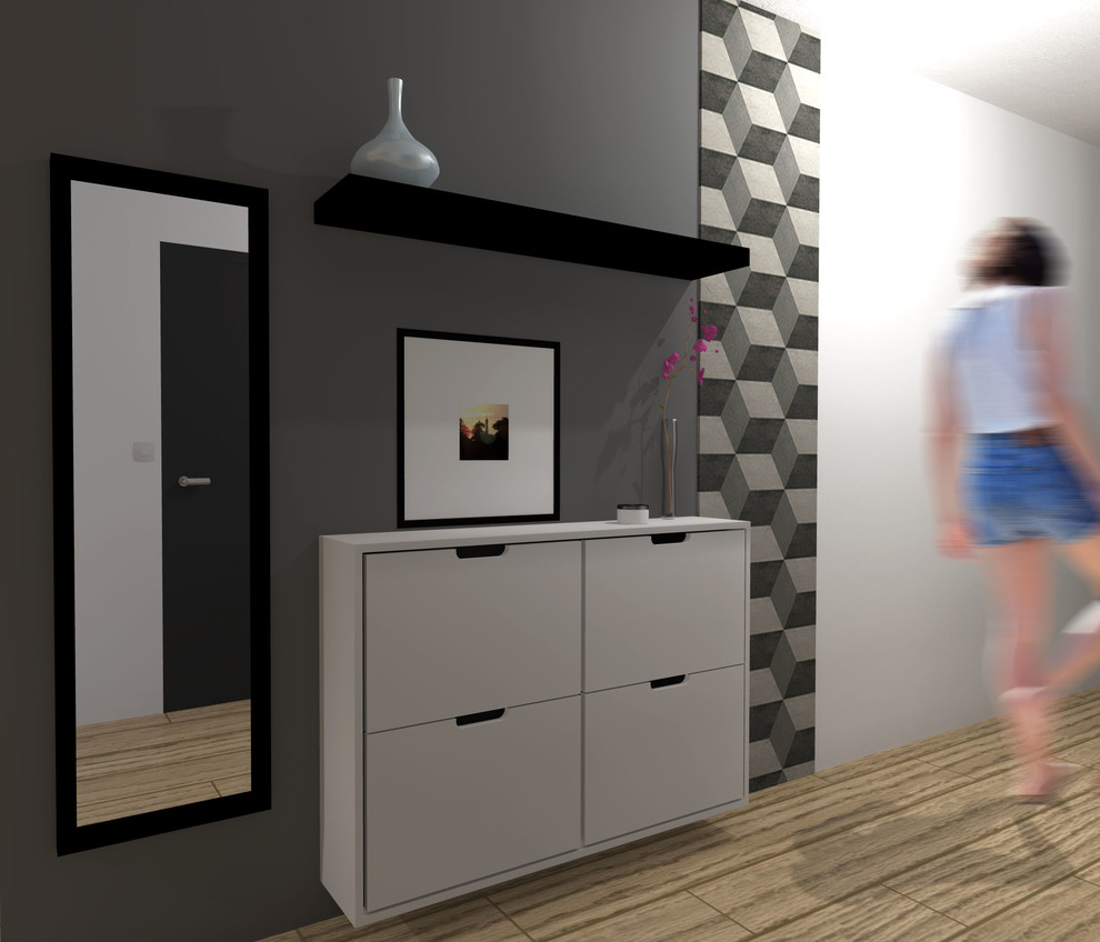 Ejemplo de hall actual pequeño con paredes grises, suelo de madera clara, puerta simple, puerta blanca y suelo beige