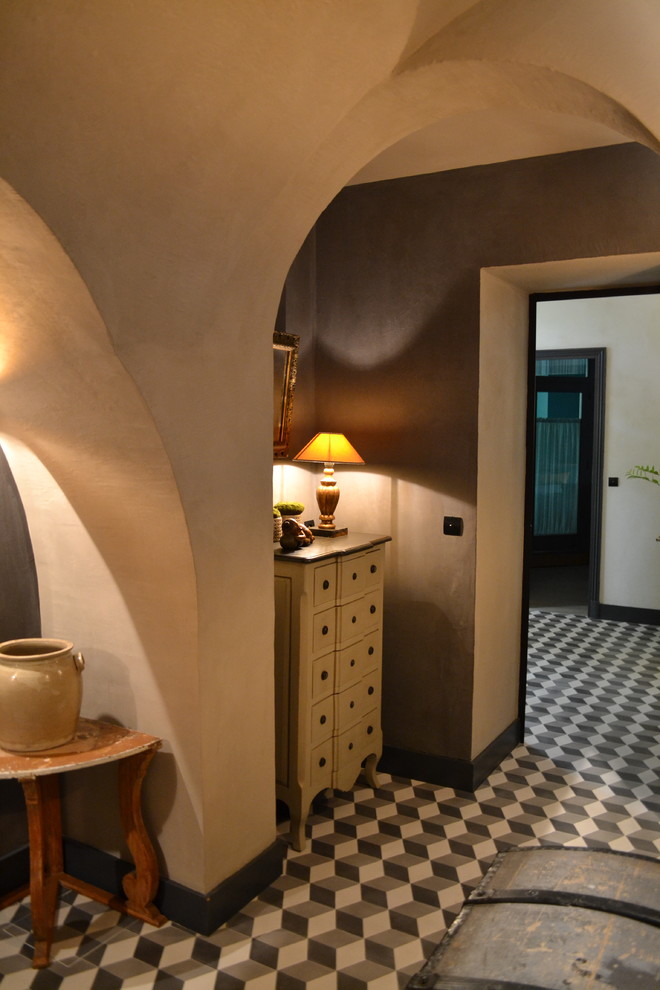 Design ideas for a medium sized modern hallway in Lyon with white walls, ceramic flooring and grey floors.