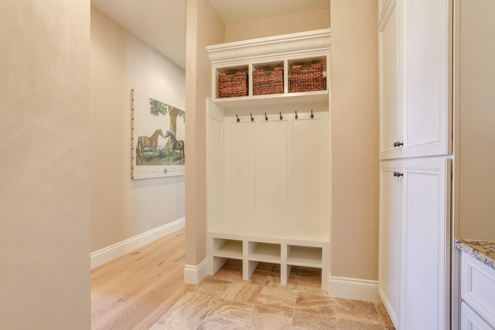 Medium sized classic boot room in Portland with beige walls and porcelain flooring.
