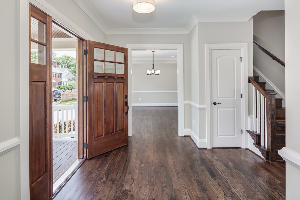 Inspiration for a cottage dark wood floor entryway remodel in DC Metro with white walls and a medium wood front door