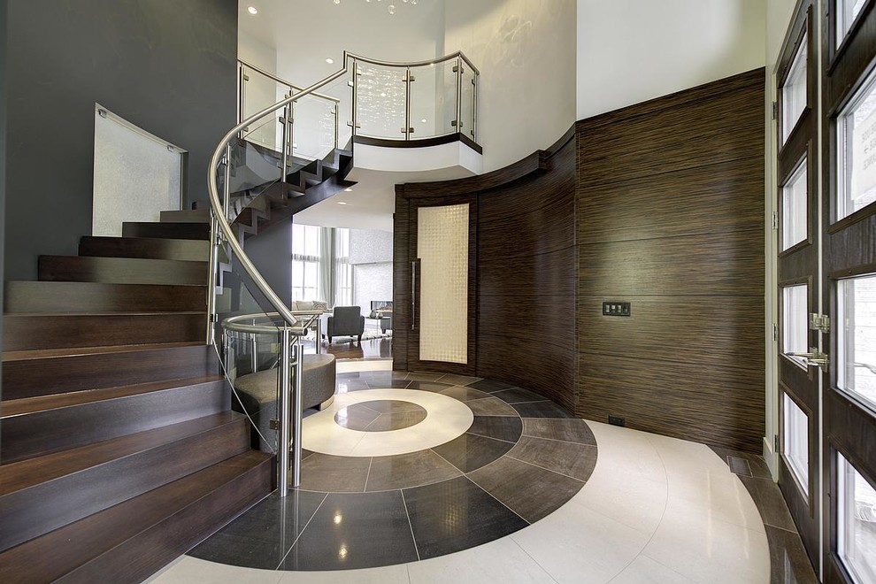 Large contemporary foyer in Other with brown walls.