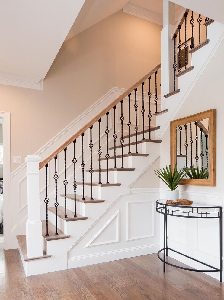 Photo of a large contemporary foyer in Boston with beige walls, medium hardwood flooring, a single front door, a white front door and brown floors.