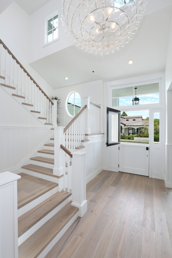 Traditional foyer in Orange County with white walls, light hardwood flooring, a stable front door and a white front door.