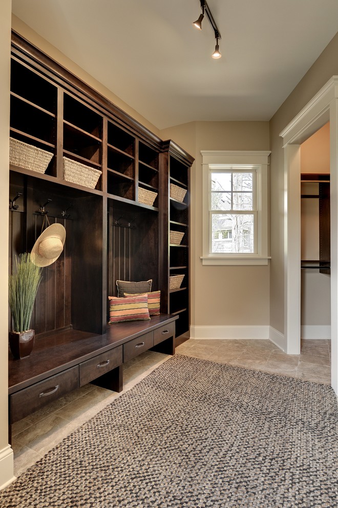 Traditional boot room in Minneapolis with feature lighting.