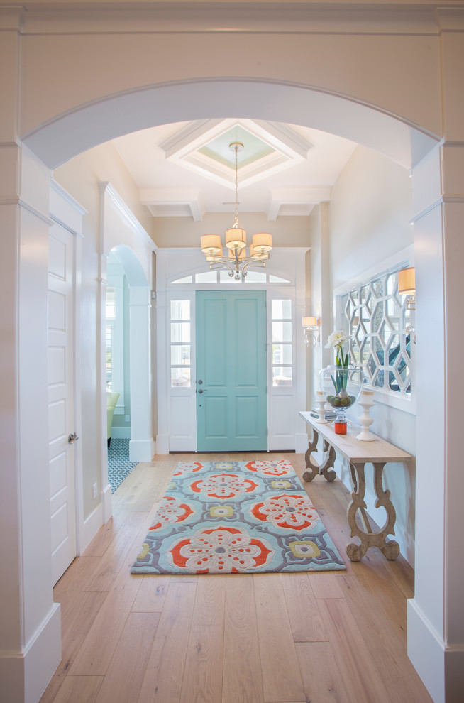 Medium sized traditional hallway in Salt Lake City with medium hardwood flooring, beige walls, a single front door, a blue front door and beige floors.