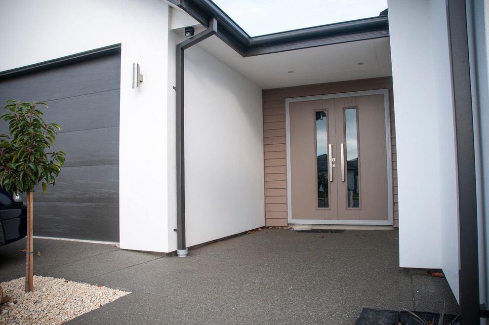 Medium sized contemporary front door in Sydney with white walls, a double front door and a brown front door.
