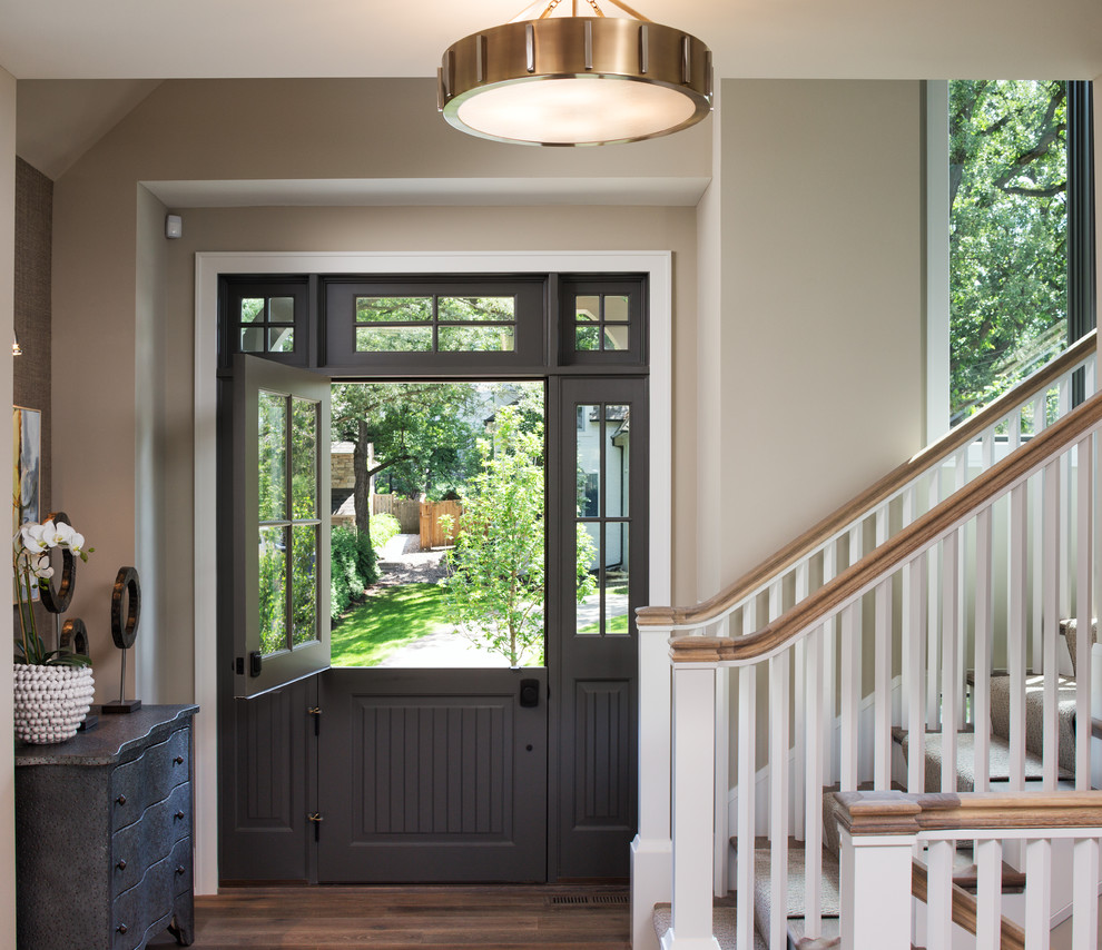 Entryway - mid-sized traditional dark wood floor entryway idea in Minneapolis with beige walls and a gray front door
