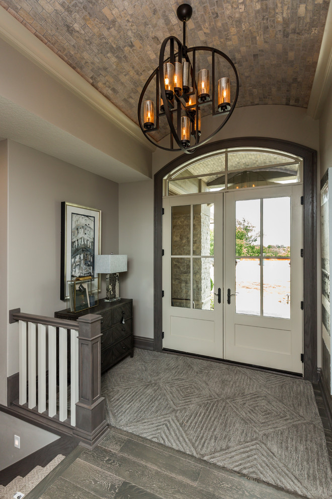 Photo of a medium sized classic foyer in Other with grey walls, medium hardwood flooring, a double front door, a white front door and grey floors.