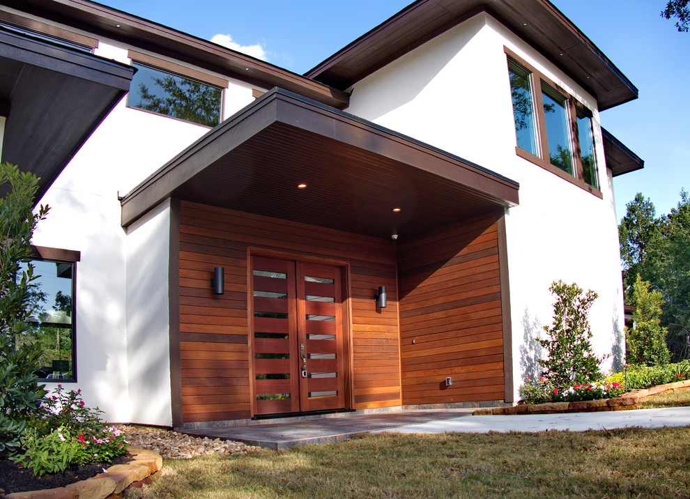 Источник вдохновения для домашнего уюта: большая входная дверь в современном стиле с коричневыми стенами, полом из керамогранита, двустворчатой входной дверью и входной дверью из дерева среднего тона