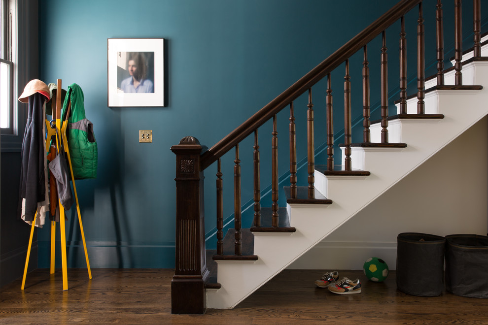 Inspiration for a large bohemian foyer in San Francisco with blue walls, medium hardwood flooring, a single front door and brown floors.