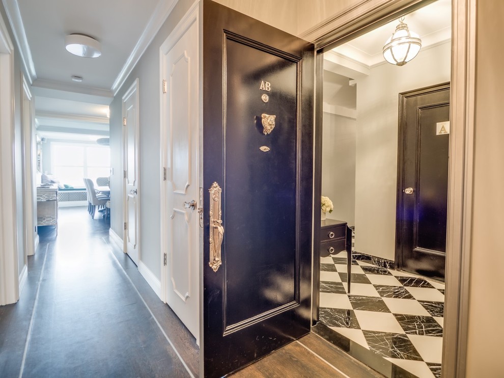 Entryway - mid-sized transitional marble floor entryway idea in New York with gray walls and a black front door