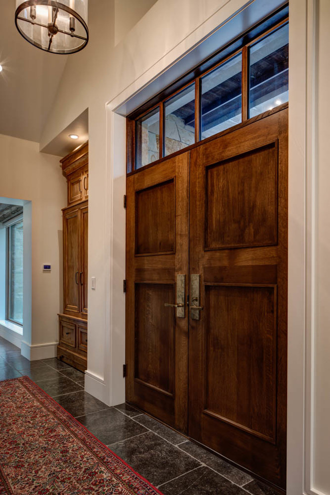 Example of a mid-sized classic entryway design in Salt Lake City with white walls and a medium wood front door