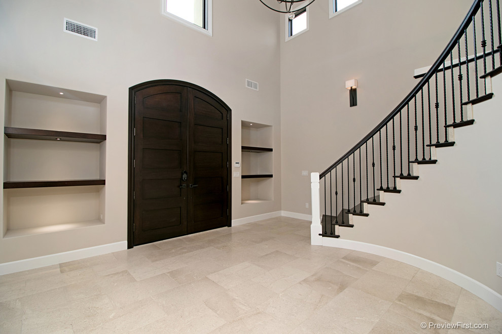 Design ideas for a large beach style foyer in Orange County with grey walls, porcelain flooring, a double front door and a brown front door.