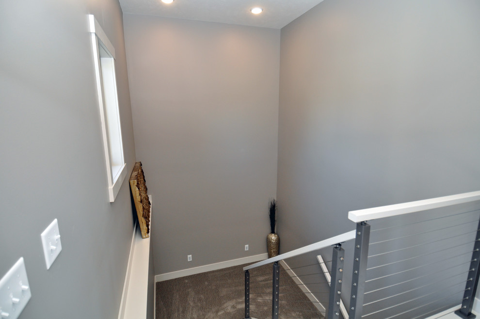Photo of a medium sized classic foyer in Other with grey walls, porcelain flooring, a single front door and a black front door.