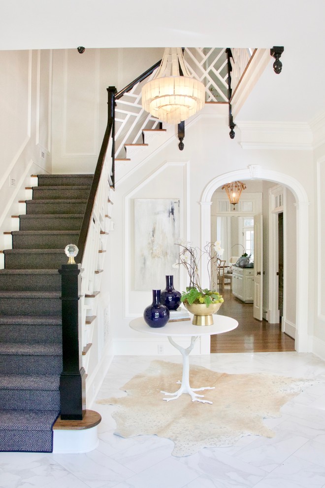 Design ideas for a large traditional foyer with grey walls, marble flooring and grey floors.