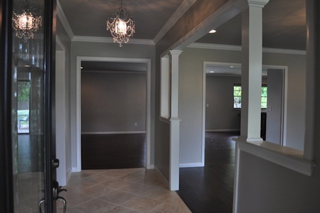 Inspiration for a mid-sized transitional ceramic tile entryway remodel in Oklahoma City with gray walls and a dark wood front door