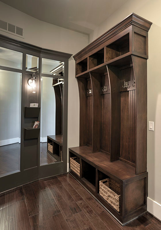 Inspiration for a mid-sized transitional dark wood floor mudroom remodel in Kansas City with gray walls
