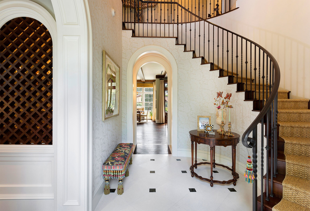 This is an example of a medium sized mediterranean foyer in Miami with beige walls, porcelain flooring, a double front door, a medium wood front door and white floors.