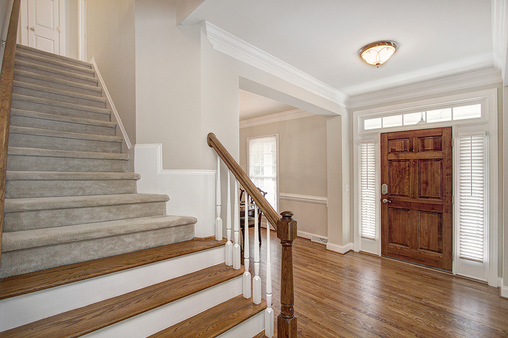 Example of an arts and crafts foyer design in Charlotte
