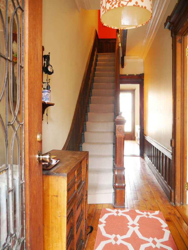 Inspiration for a small victorian porcelain tile entryway remodel in New York with a white front door