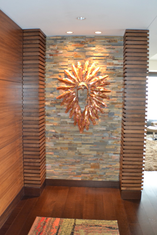 Contemporary entrance in Denver with multi-coloured walls, dark hardwood flooring, a single front door and a dark wood front door.