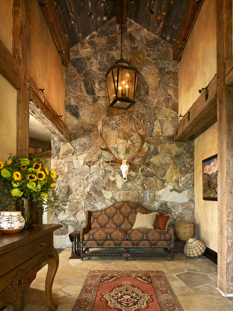 Inspiration for a traditional foyer in Denver with beige walls.